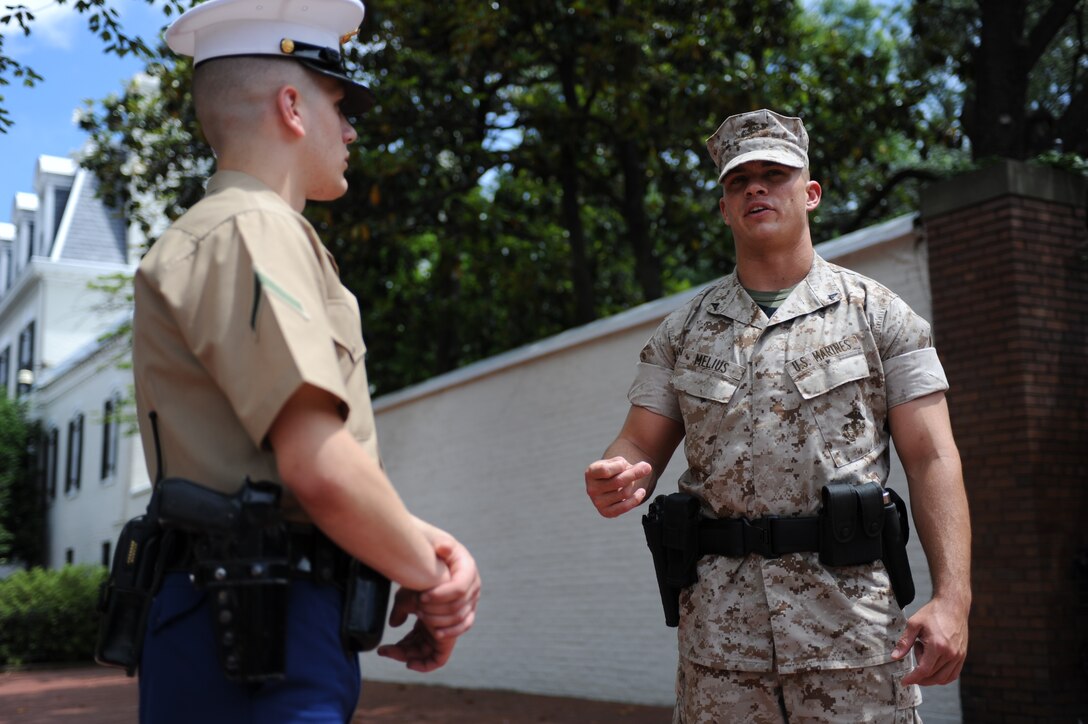 Lance Cpl. Bryan Melius talks with Pfc. Alexander Allen outside the Home of the Commandants May 25. Melius serves as the corporal of the guard at Marine Barracks Washington. (Photo by Cpl. Joseph C. Cabrera)